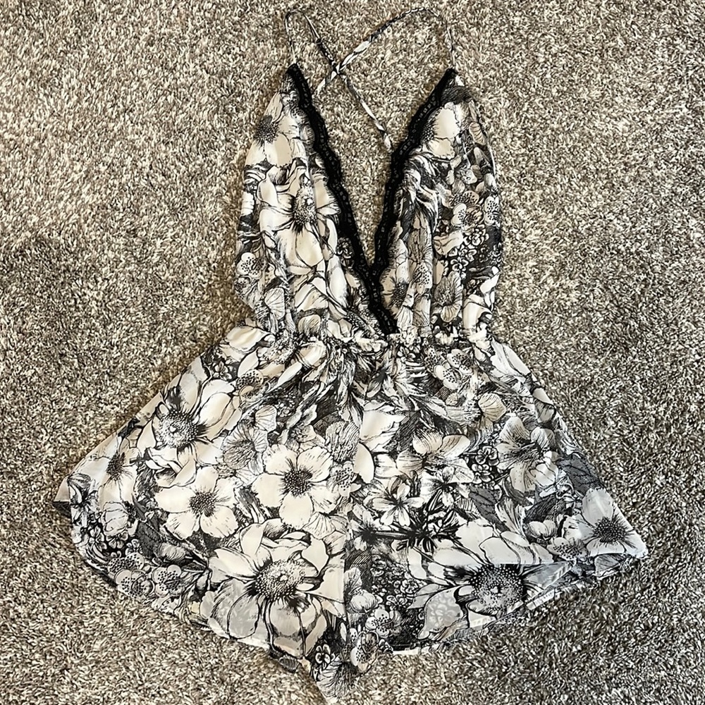 Brand Kaitlyn, Size Medium. Chiffon/lace romper. Black and white floral.